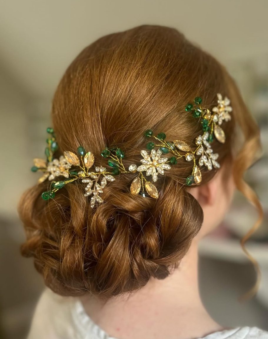 Low textured bridal bun with flower decoration