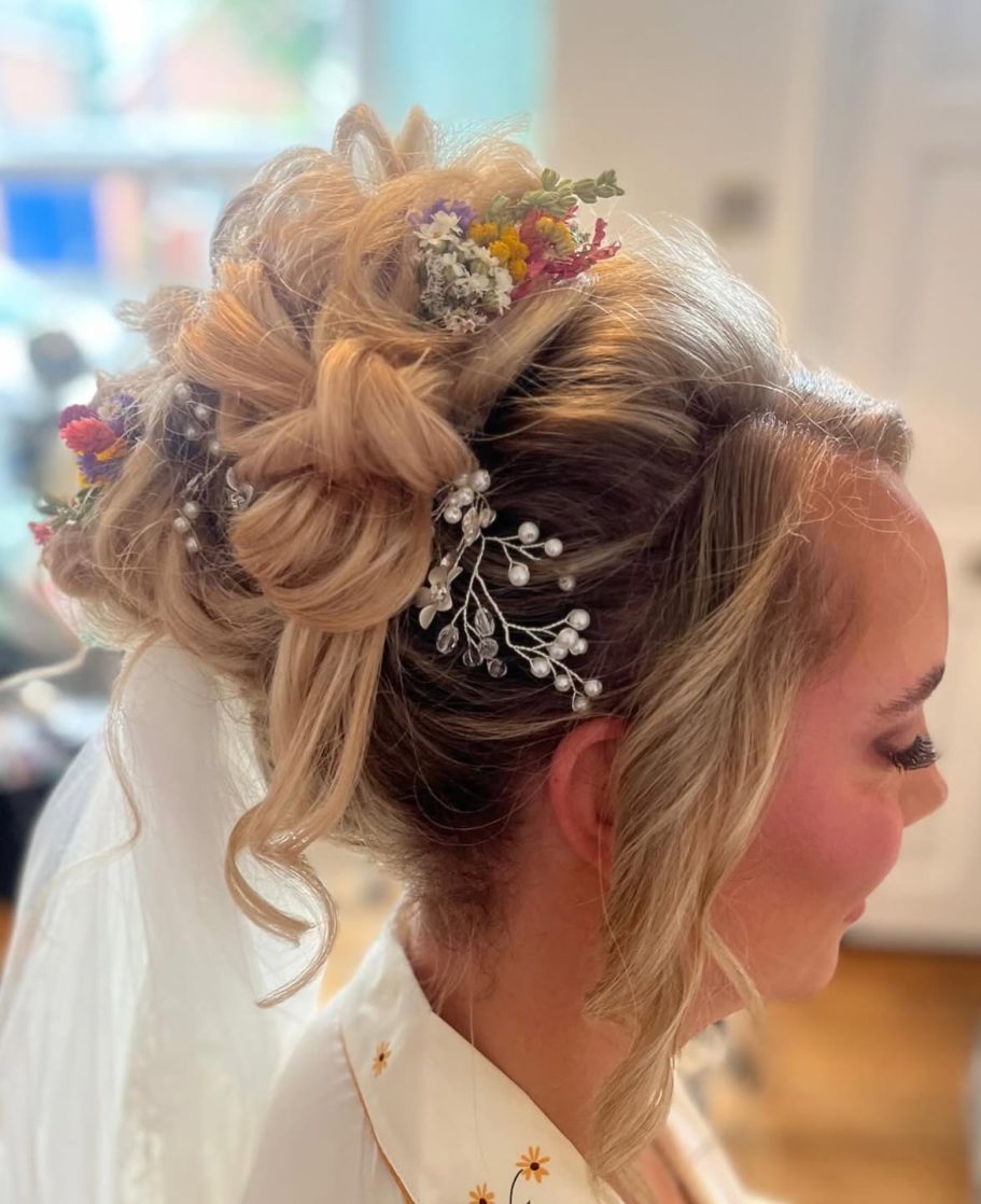 High bridal updo with flowers