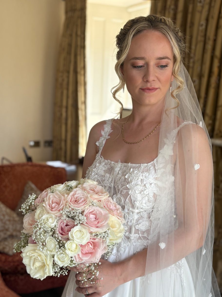 beautiful bridal hair and makeup, soft natural glam makeup with a textured updo and face framing pieces