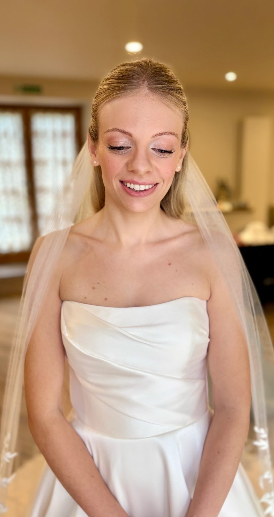 Gorcott Hall, Redditch beautiful bride with natural makeup, with soft lashes with a half up hairstyle and wearing a veil At Gorcott Hall, Redditch, Worcestershire