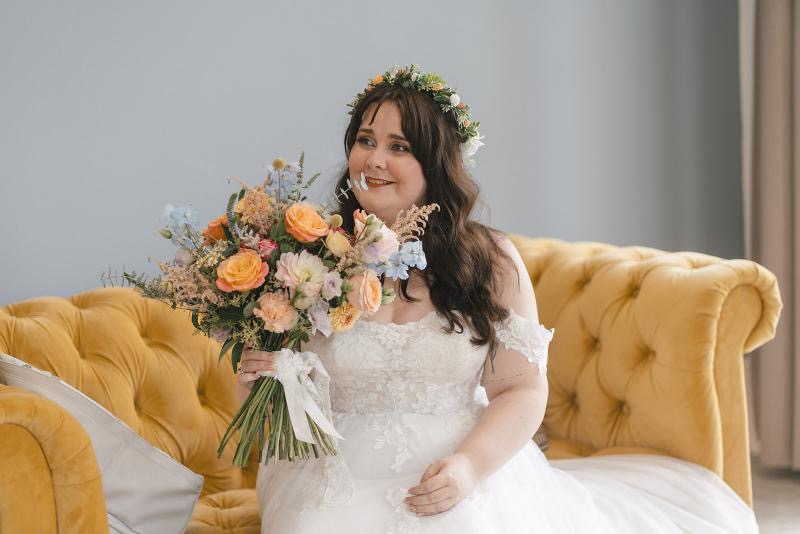 Leamington Spa Whimsical bridal hair with loose waves and a flower crown, natural makeup at leamington spa